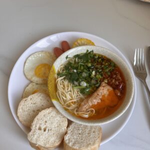 Noodle soup, fried egg and bread at the Shanghai transit hotel breakfast